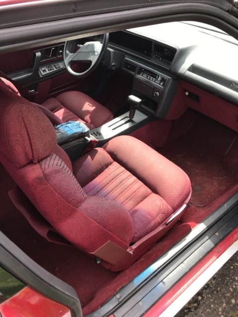 1989 Red Oldsmobile Cutlass Coupe