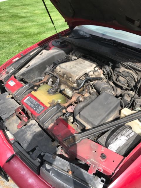 1989 Red Oldsmobile Cutlass Coupe
