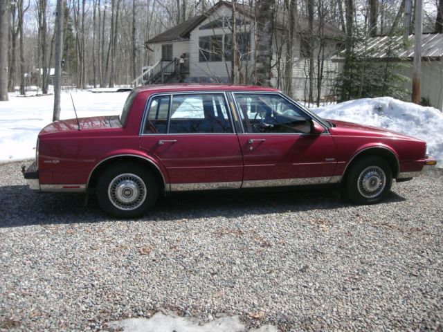 1989 red /burgandy Oldsmobile Ninety-Eight Sedan