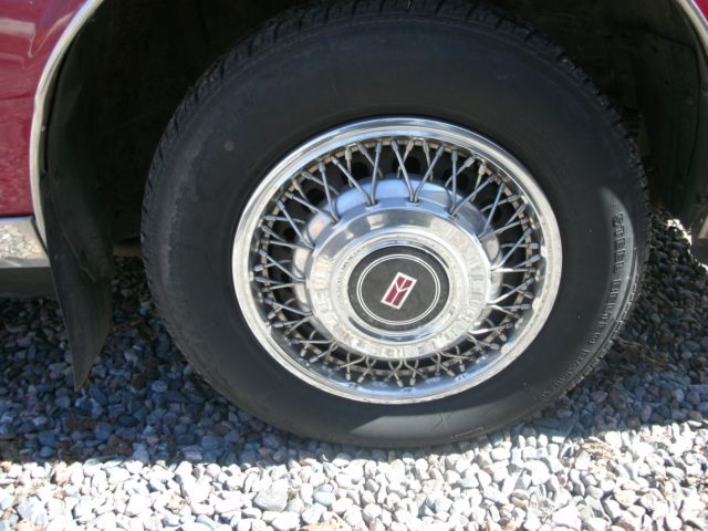 1989 red /burgandy Oldsmobile Ninety-Eight Sedan