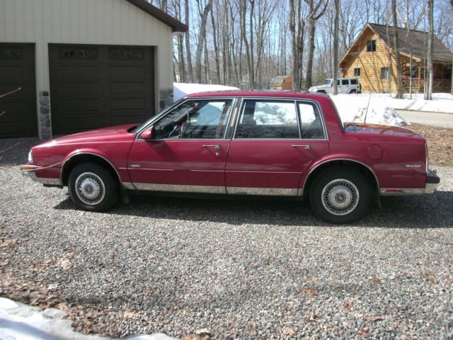 1989 red /burgandy Oldsmobile Ninety-Eight Sedan