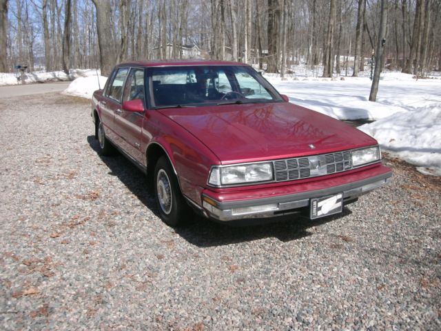 1989 red /burgandy Oldsmobile Ninety-Eight Sedan