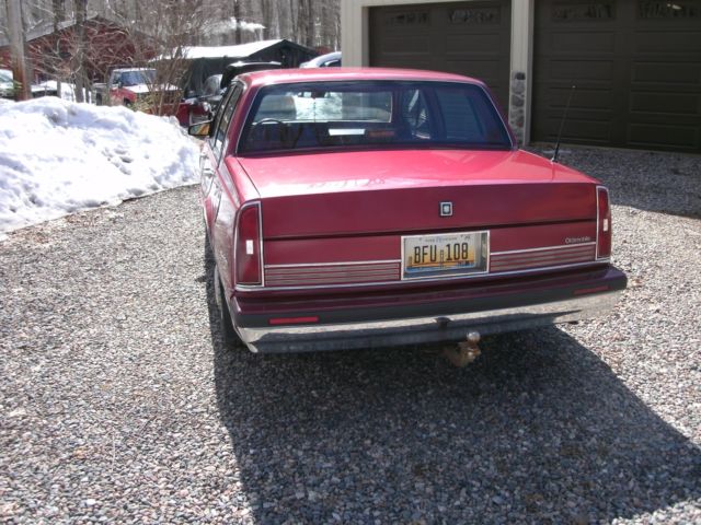 1989 red /burgandy Oldsmobile Ninety-Eight Sedan