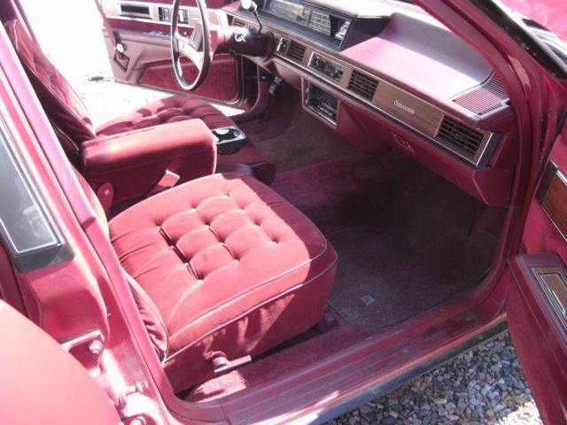 1989 red /burgandy Oldsmobile Ninety-Eight Sedan