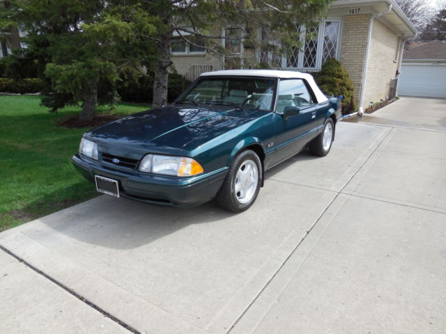 1990 dark emerald green metallic Ford Mustang Convertible