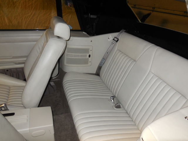 1990 dark emerald green metallic Ford Mustang Convertible