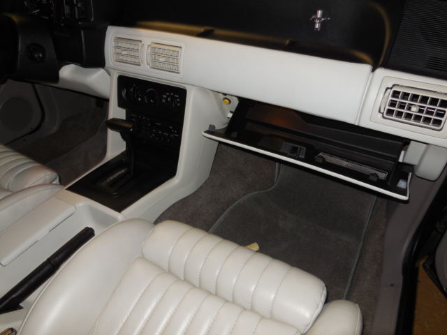 1990 dark emerald green metallic Ford Mustang Convertible