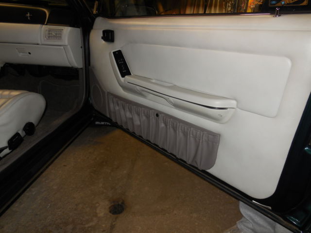 1990 dark emerald green metallic Ford Mustang Convertible