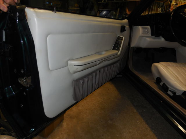 1990 dark emerald green metallic Ford Mustang Convertible