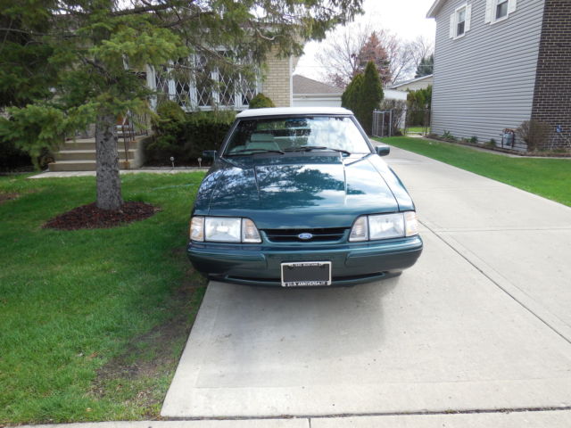 1990 dark emerald green metallic Ford Mustang Convertible