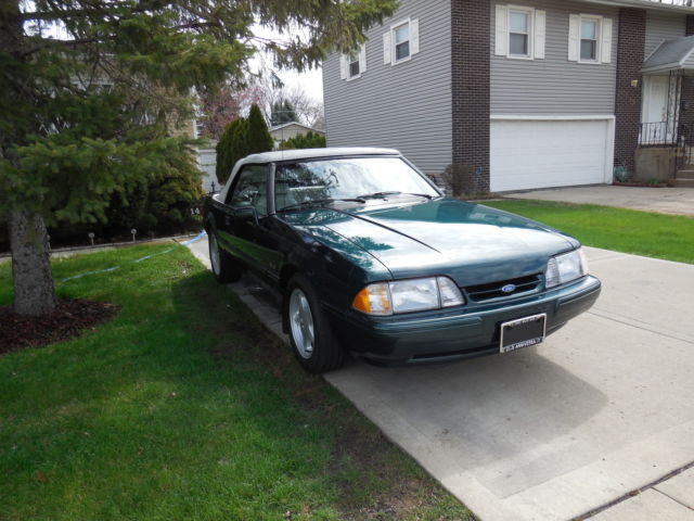 1990 dark emerald green metallic Ford Mustang Convertible