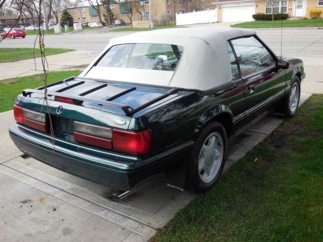 1990 dark emerald green metallic Ford Mustang Convertible