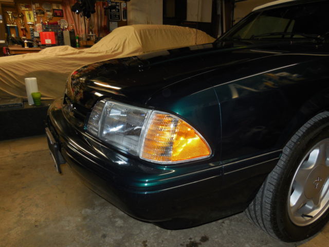 1990 dark emerald green metallic Ford Mustang Convertible