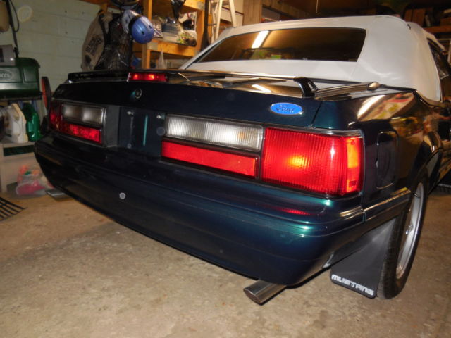 1990 dark emerald green metallic Ford Mustang Convertible