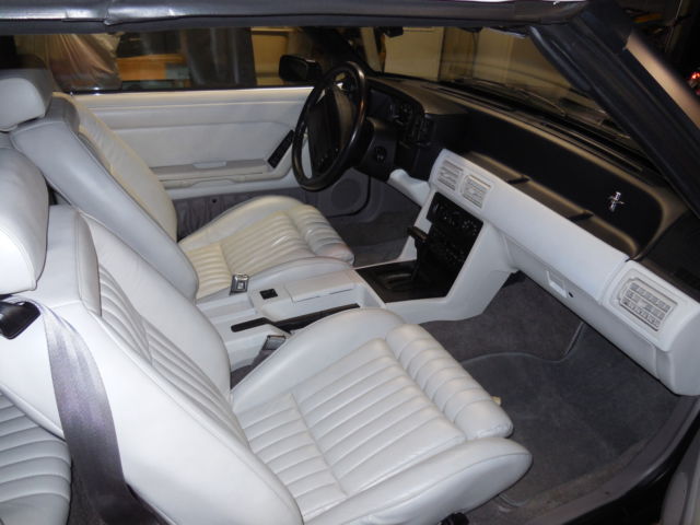 1990 dark emerald green metallic Ford Mustang Convertible