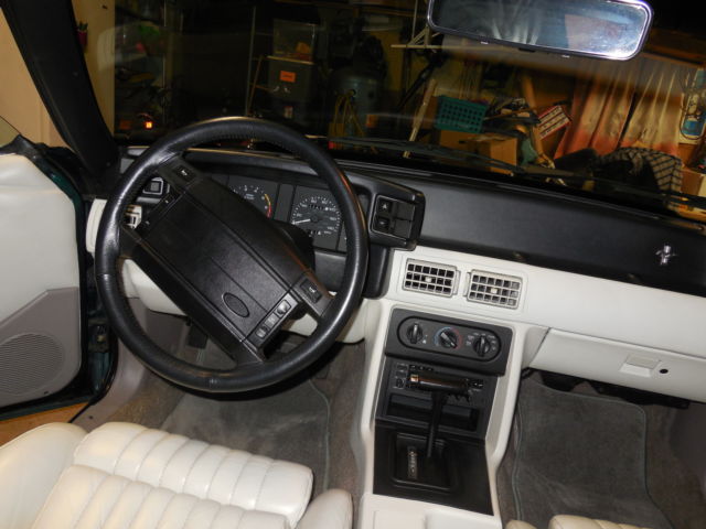 1990 dark emerald green metallic Ford Mustang Convertible