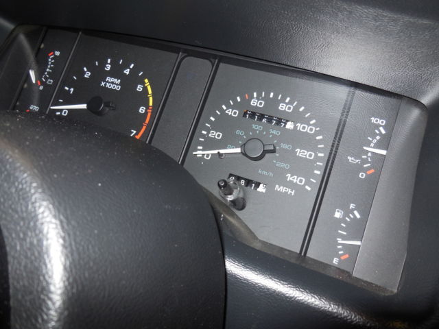 1990 dark emerald green metallic Ford Mustang Convertible