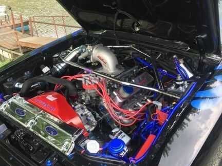 1990 Black and blue Ford Mustang
