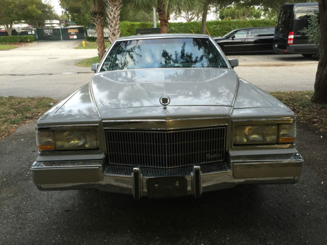 1990 light grey Cadillac Brougham Sedan