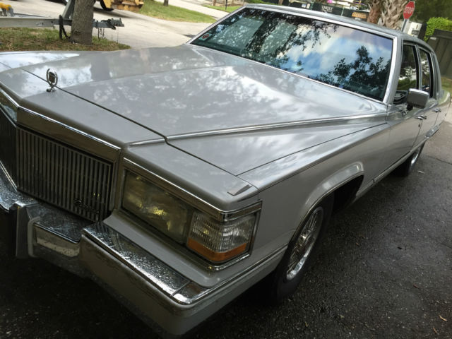 1990 light grey Cadillac Brougham Sedan