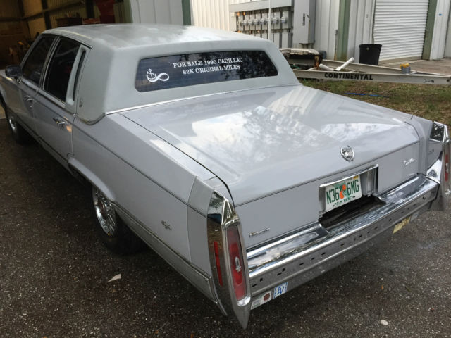 1990 light grey Cadillac Brougham Sedan