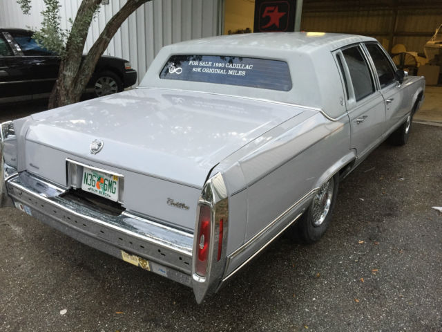 1990 light grey Cadillac Brougham Sedan