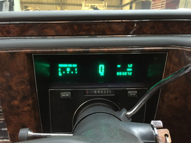 1990 light grey Cadillac Brougham Sedan