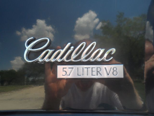 1990 Black Cadillac Brougham Sedan