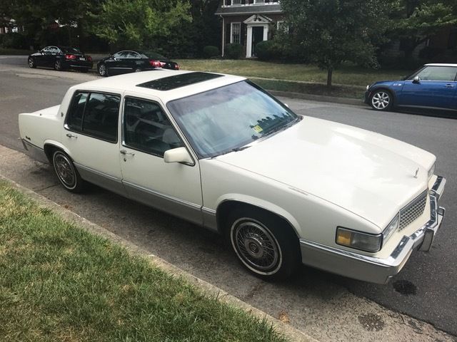 1990 White Cadillac DeVille Sedan