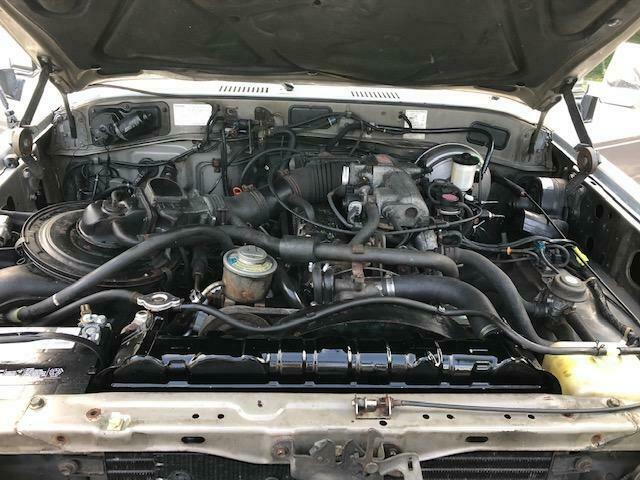 1990 Silver and White Toyota Land Cruiser Wagon