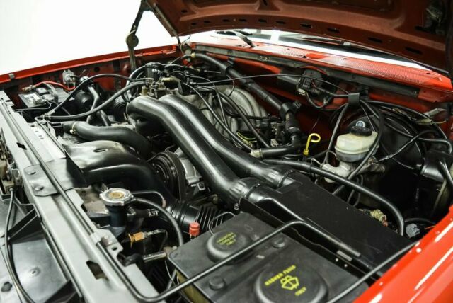 1990 Red Ford Bronco --