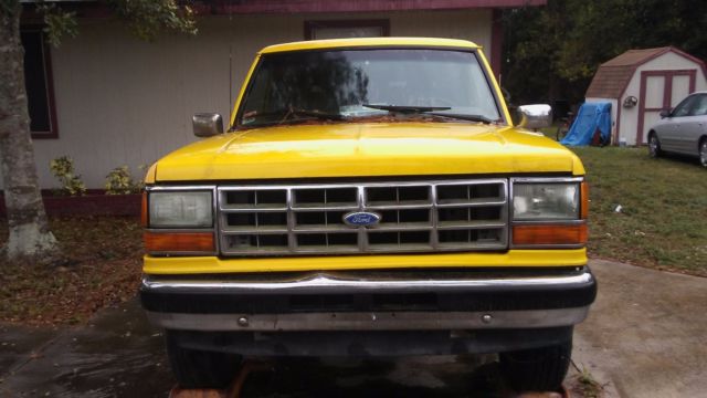 1990 Yellow Ford Bronco SUV
