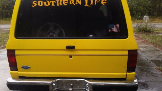 1990 Yellow Ford Bronco SUV