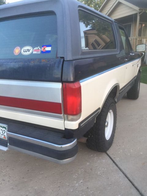 1990 blue/white Ford Bronco