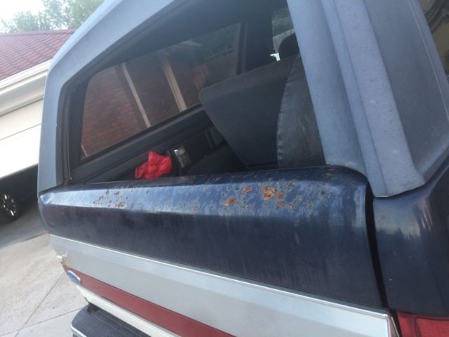 1990 blue/white Ford Bronco