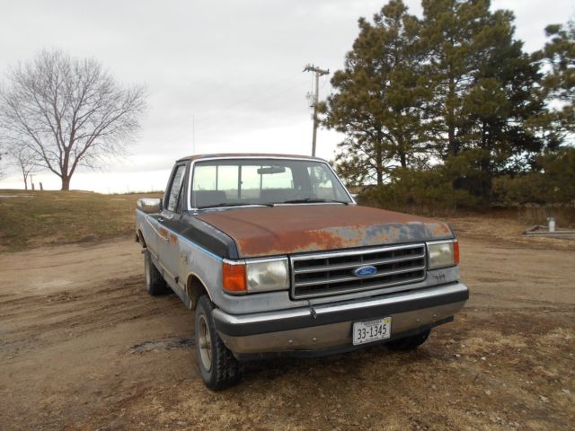 1990 Red Ford F-150 Standard Cab Pickup