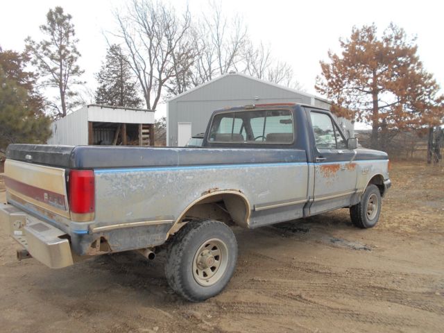 1990 Red Ford F-150 Standard Cab Pickup