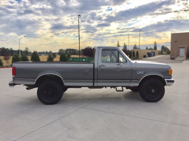 1990 grey Ford F-250 single cab pick up