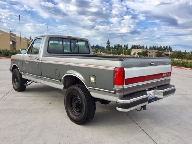 1990 grey Ford F-250 single cab pick up