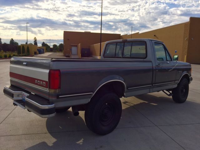 1990 grey Ford F-250 single cab pick up