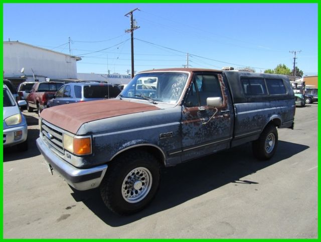 1990 Blue Ford F-250 Pickup Truck