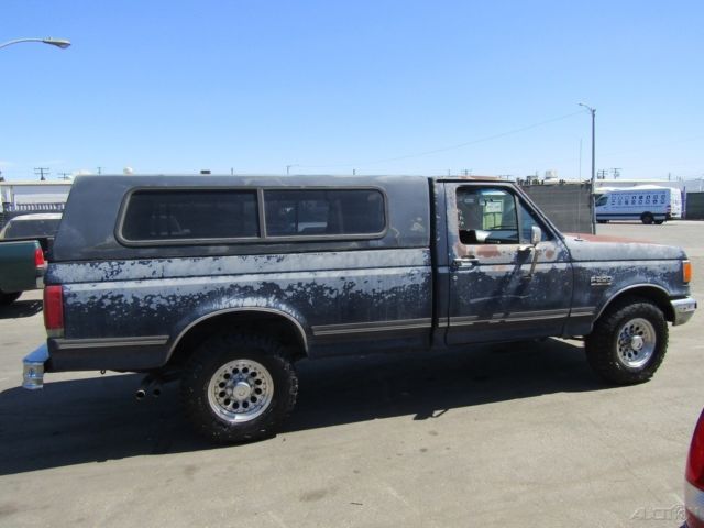 1990 Blue Ford F-250 Pickup Truck