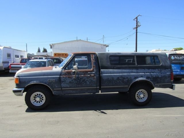 1990 Blue Ford F-250 Pickup Truck