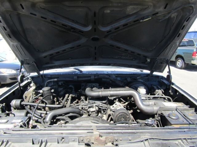 1990 Blue Ford F-250 Pickup Truck