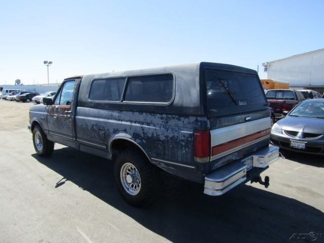 1990 Blue Ford F-250 Pickup Truck