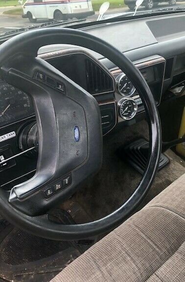 1990 Black Ford F-350 Roll Back