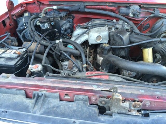 1990 Red Ford F-150 Standard Cab Pickup