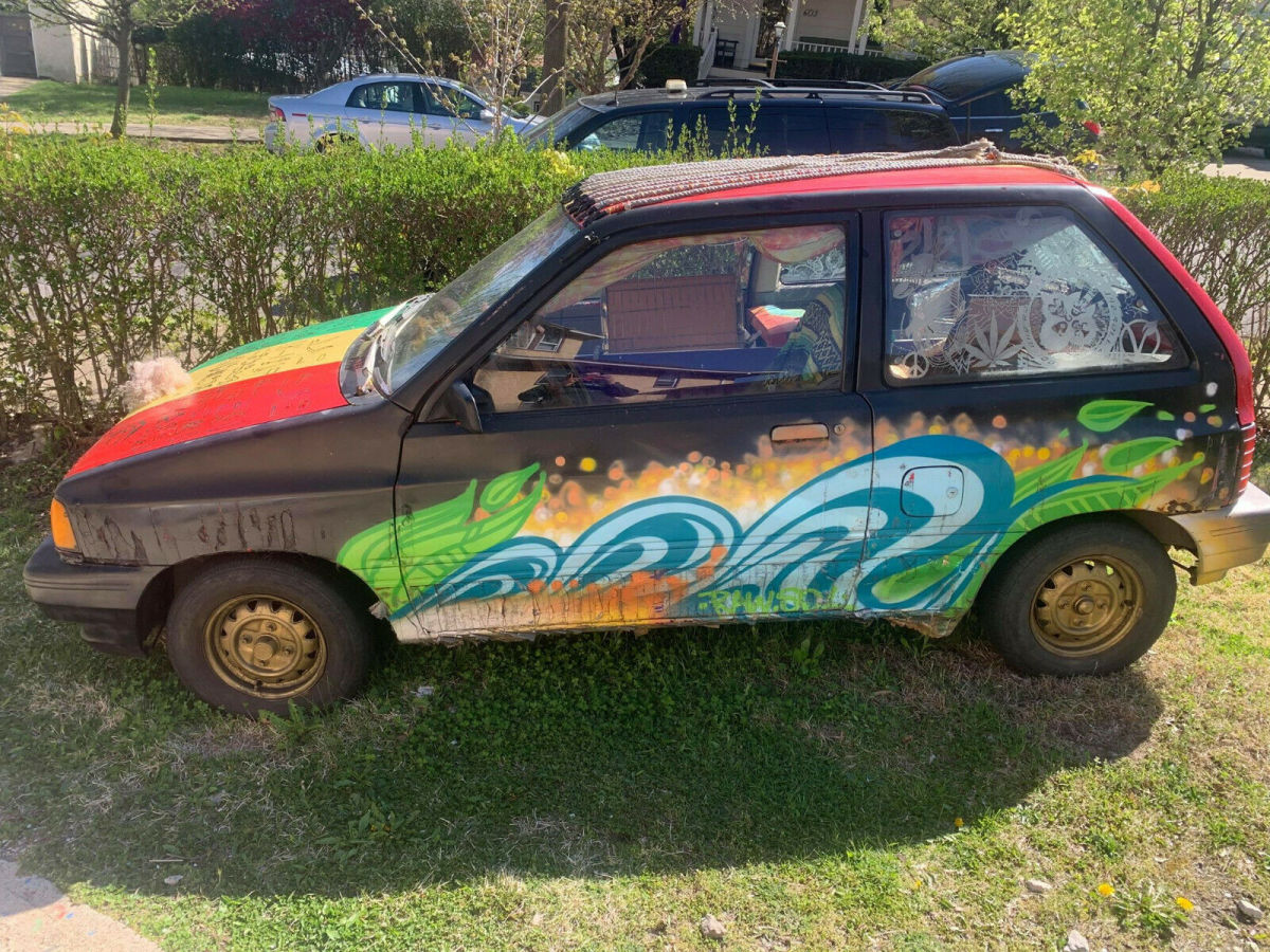 1990 Red Ford Festiva Hatchback