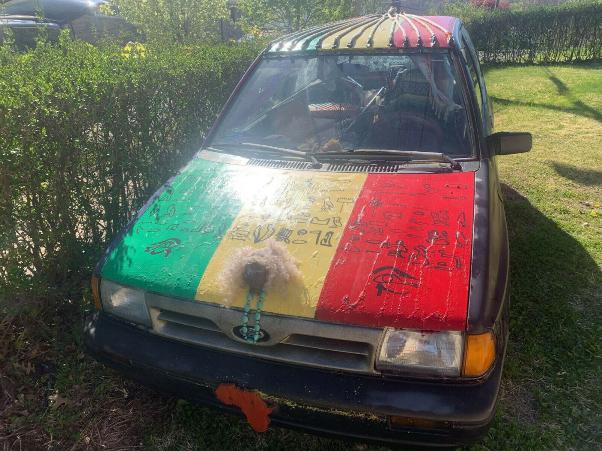 1990 Red Ford Festiva Hatchback
