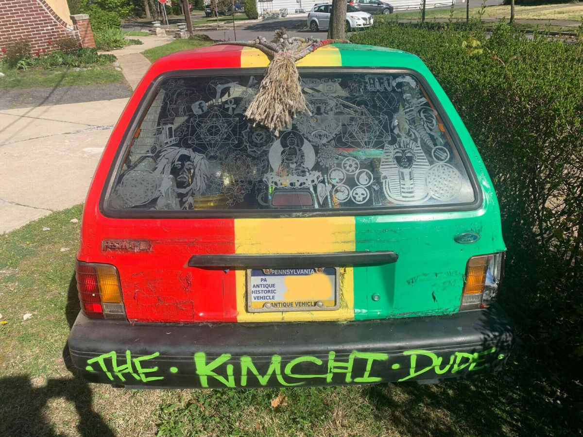 1990 Red Ford Festiva Hatchback